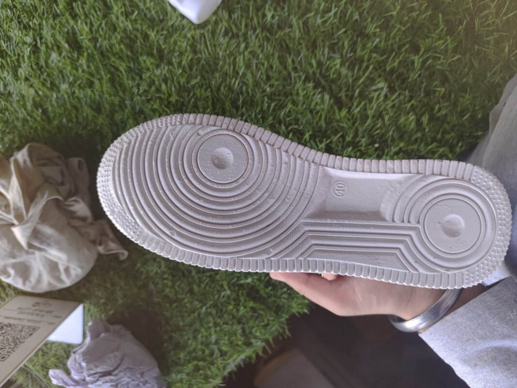 cleaning the sole of the adidas sneaker