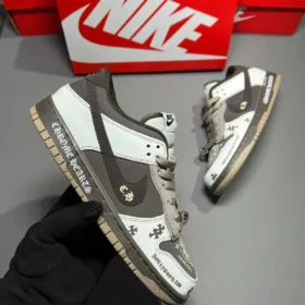 pair of nike dunks low chrome hearts