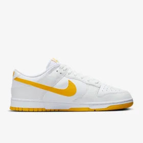 side view of orange white nike retro low