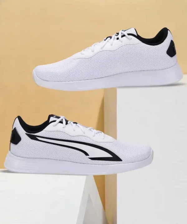 pair of puma tychonic sneakers white