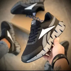 reebok black zig dynamica in hand