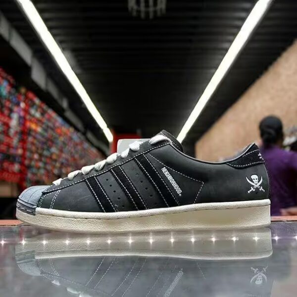 side view of adidas superstar clot x neighborhood