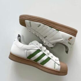 pair of adidas superstar melting sadness off white green