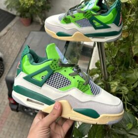 jordan 4 green in hand