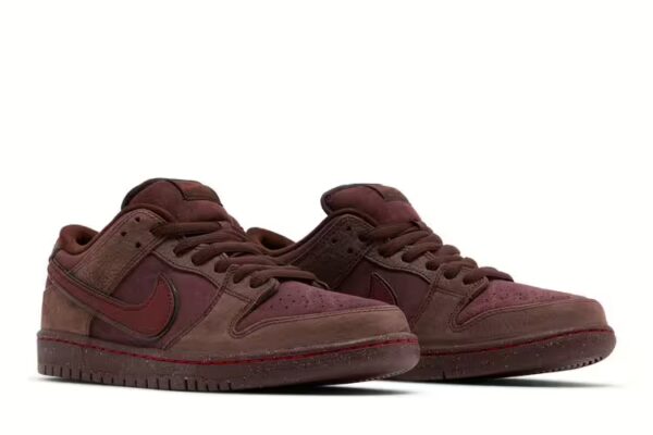 pair of nike sb dunk burgundy