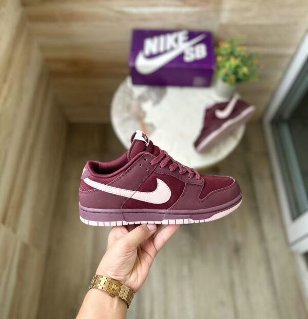 nike sb dunk burgundy in hand