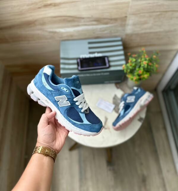 new balance 2002r in hand blue color shoes with box